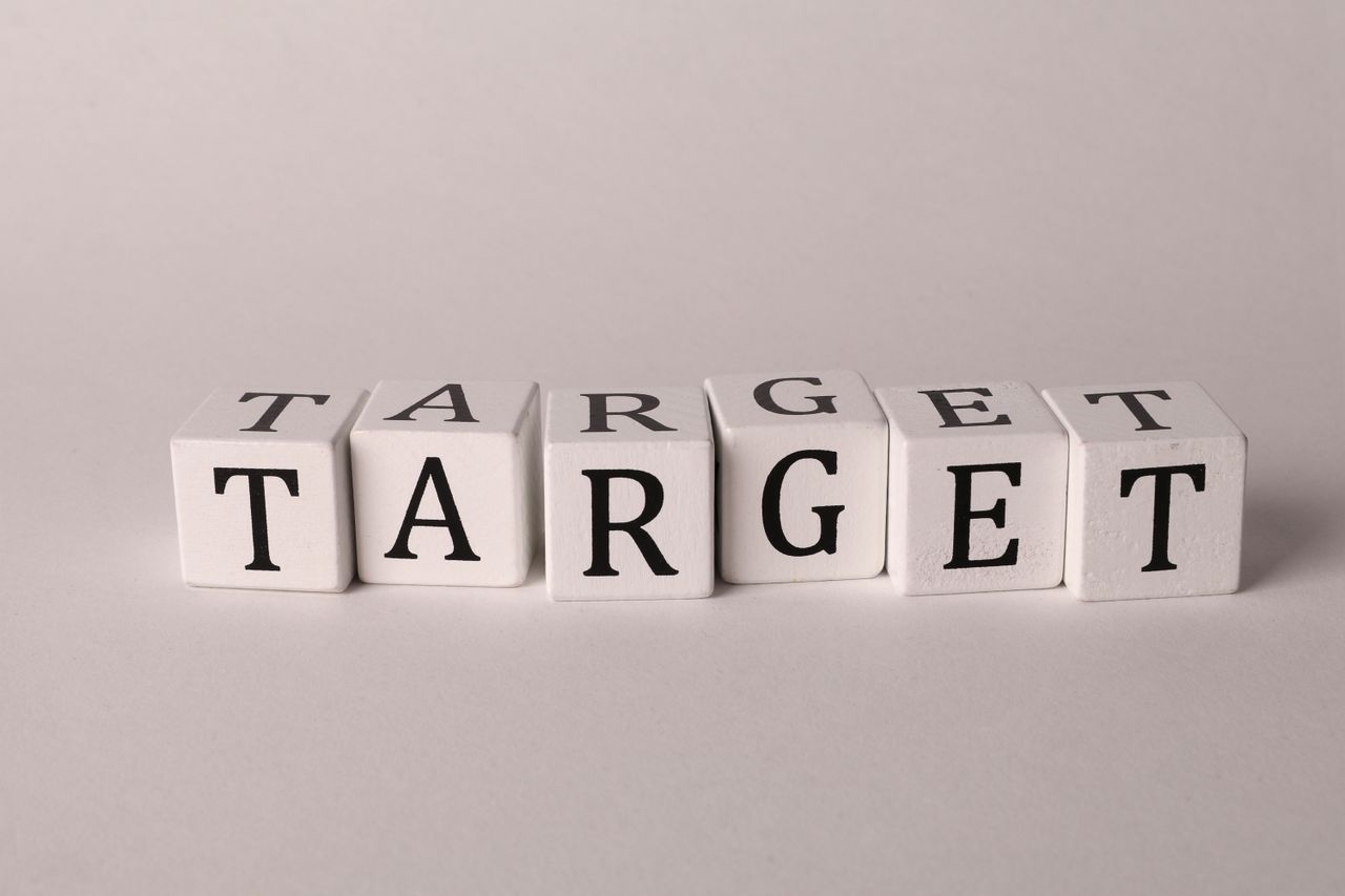 services-02 White cubes spelling TARGET on a neutral background, ideal for business or marketing concepts.